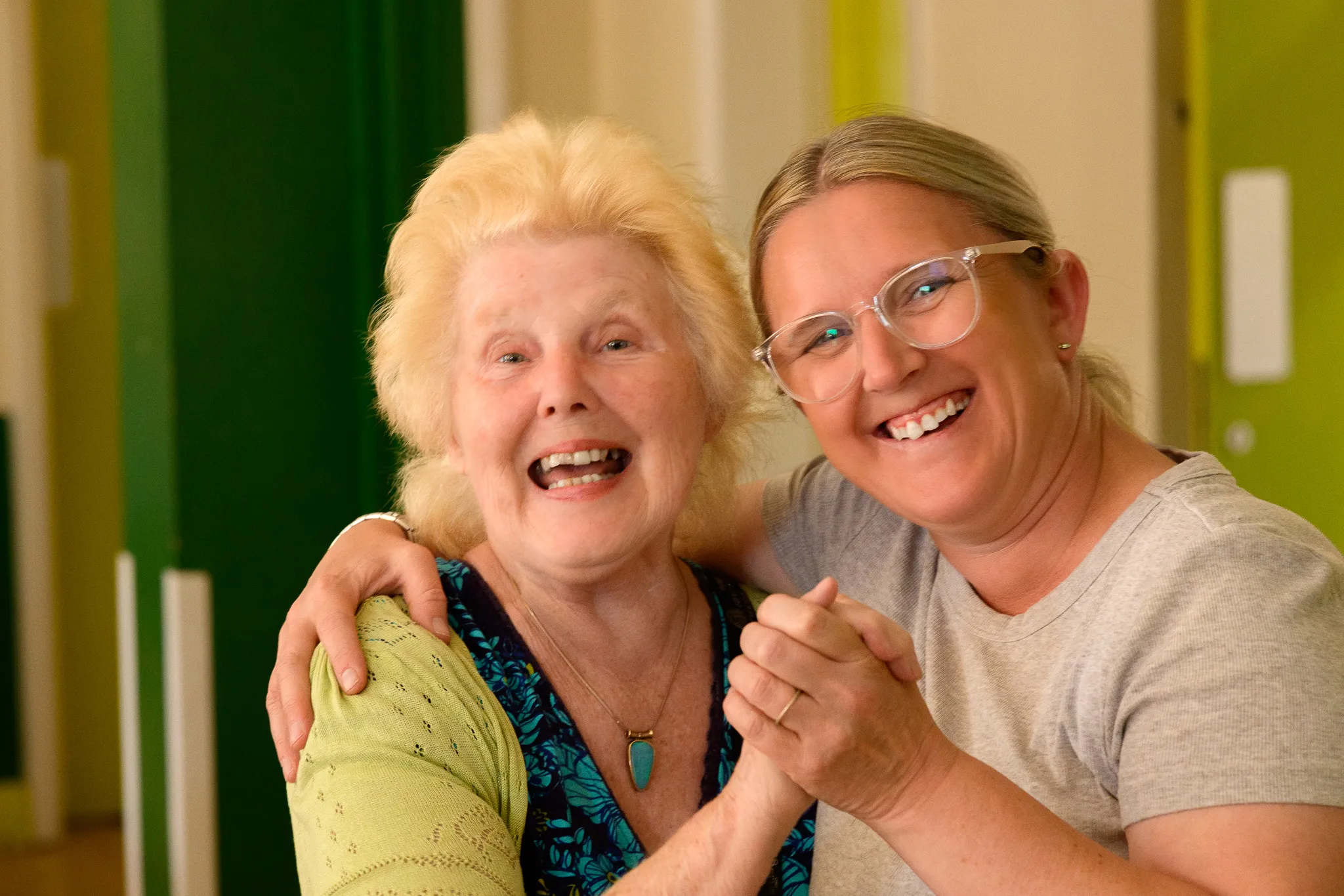 Two people smiling together at a Chesterfield community gathering